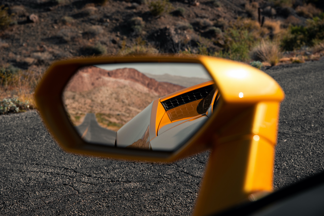 Empty Road Visible in Sports Car Mirror