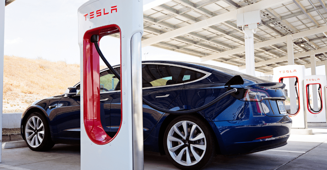 A Tesla rental at a charging station.