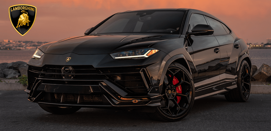 Black SUV parked by the waterfront during sunset, with sporty design and black rims